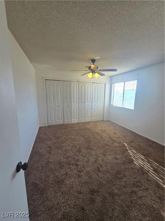 2232 Aspen Mirror Way Unit 204, Laughlin, NV 89029 - unfurnished bedroom featuring carpet flooring, a textured ceiling, and ceiling fan