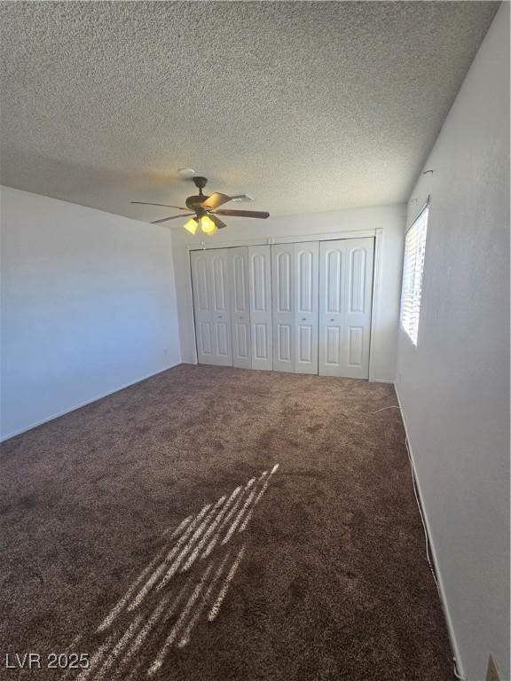 2232 Aspen Mirror Way Unit 204, Laughlin, NV 89029 - unfurnished bedroom with carpet, a textured ceiling, and a ceiling fan