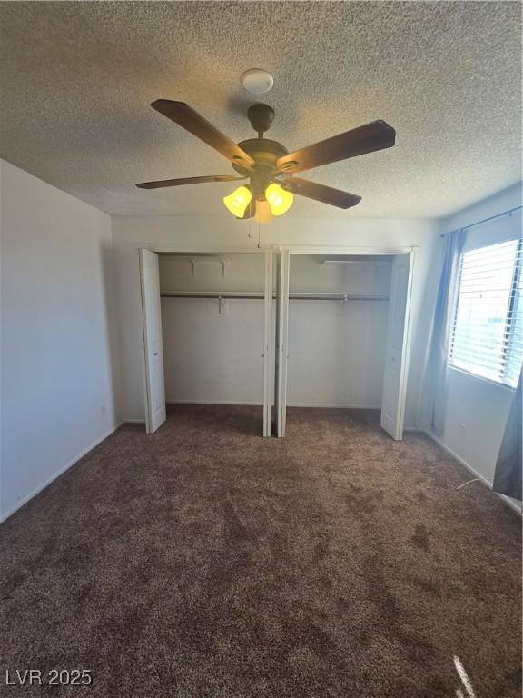 2232 Aspen Mirror Way Unit 204, Laughlin, NV 89029 - unfurnished bedroom with multiple closets, carpet flooring, a textured ceiling, and ceiling fan
