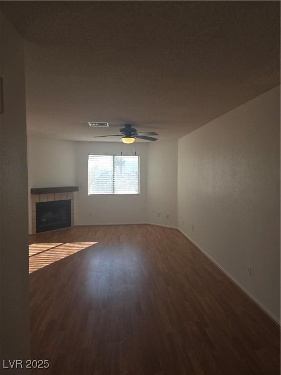 2232 Aspen Mirror Way Unit 204, Laughlin, NV 89029 - unfurnished living room with wood finished floors, a fireplace, ceiling fan, and baseboards