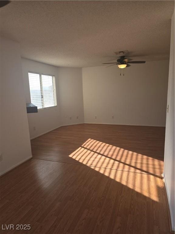 2232 Aspen Mirror Way Unit 204, Laughlin, NV 89029 - spare room featuring ceiling fan, a textured ceiling, wood finished floors, and baseboards