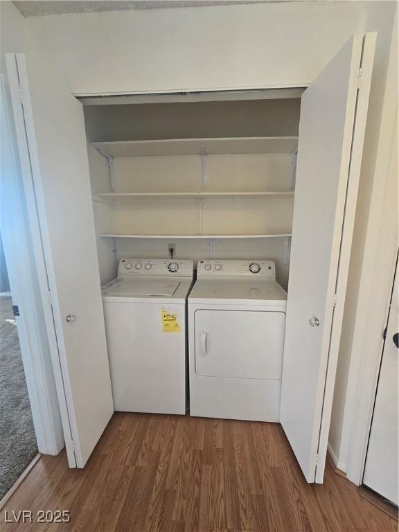 2232 Aspen Mirror Way Unit 204, Laughlin, NV 89029 - washroom with washing machine and dryer and dark wood-style flooring