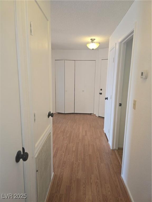 2232 Aspen Mirror Way Unit 204, Laughlin, NV 89029 - corridor with wood finished floors and baseboards