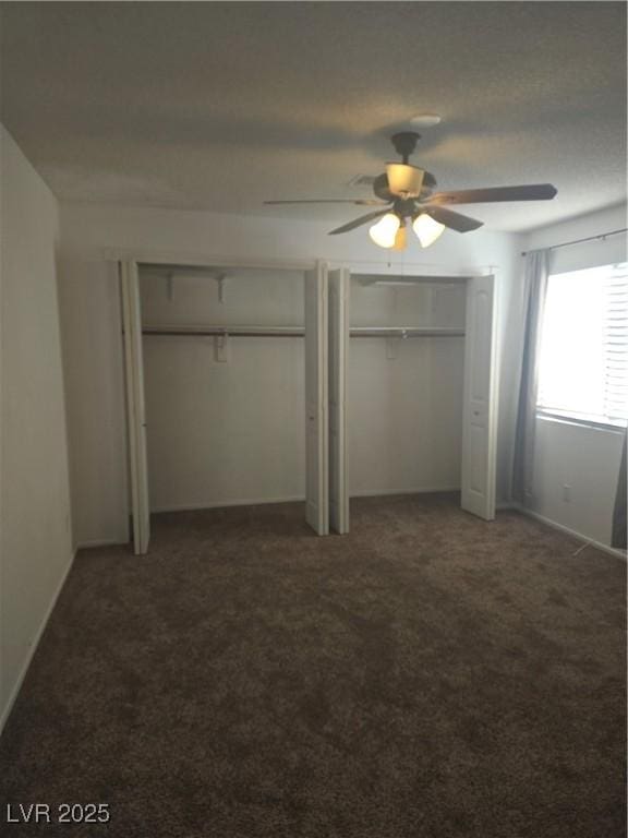 2232 Aspen Mirror Way Unit 204, Laughlin, NV 89029 - unfurnished bedroom with multiple closets, carpet flooring, ceiling fan, and baseboards