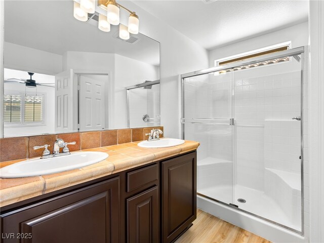 4016 Balsam Mountain St, Las Vegas, NV 89129 - full bath featuring a stall shower, double vanity, wood finished floors, and a ceiling fan