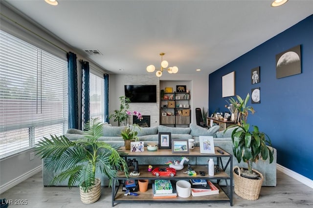 11769 Via Vera Cruz Ct, Las Vegas, NV 89138 - living room featuring plenty of natural light, baseboards, a chandelier, wood finished floors, and recessed lighting