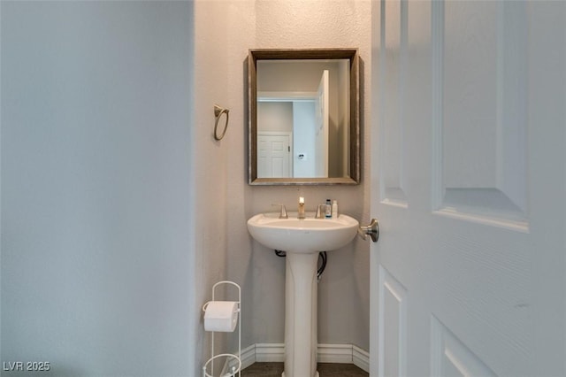 11769 Via Vera Cruz Ct, Las Vegas, NV 89138 - bathroom with baseboards and a sink