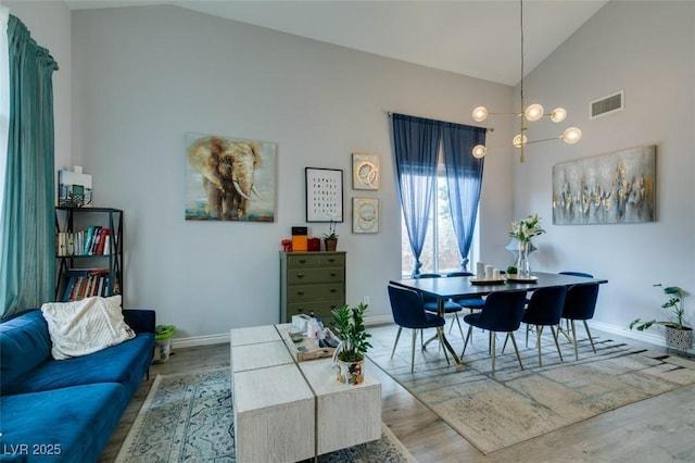 11769 Via Vera Cruz Ct, Las Vegas, NV 89138 - dining room with vaulted ceiling, wood finished floors, and baseboards