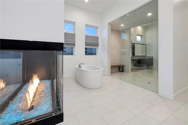 148 Tre Pietre St, Henderson, NV 89011 - full bath featuring recessed lighting, a freestanding tub, baseboards, and tile patterned flooring