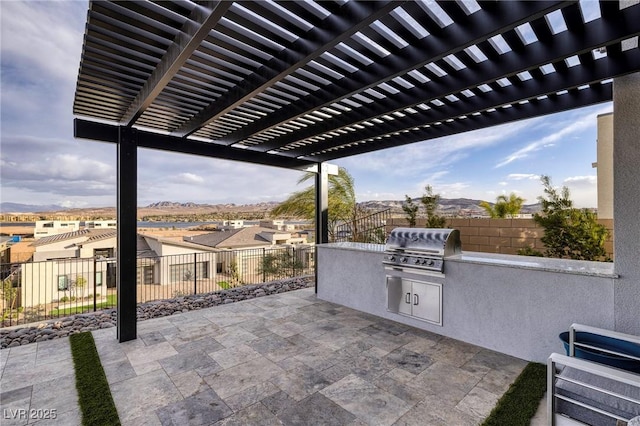 148 Tre Pietre St, Henderson, NV 89011 - view of patio / terrace featuring area for grilling, an outdoor kitchen, a fenced backyard, and a pergola