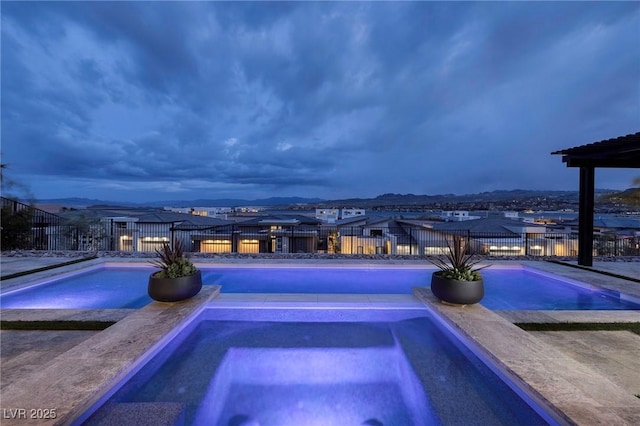 148 Tre Pietre St, Henderson, NV 89011 - view of swimming pool with a fenced in pool, an in ground hot tub, and fence