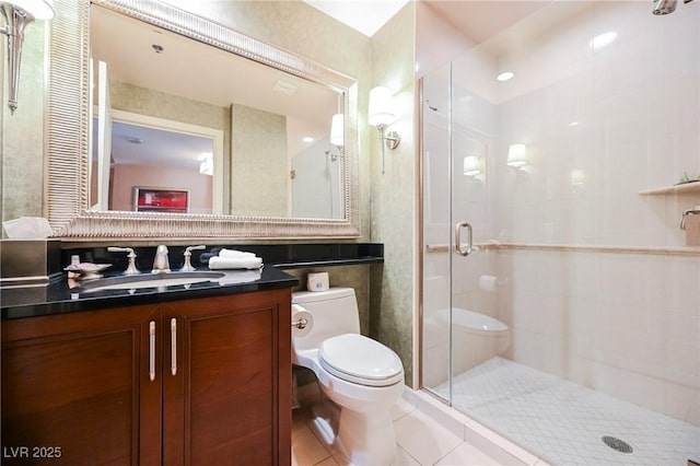 bathroom featuring vanity, toilet, a shower stall, and tile patterned flooring