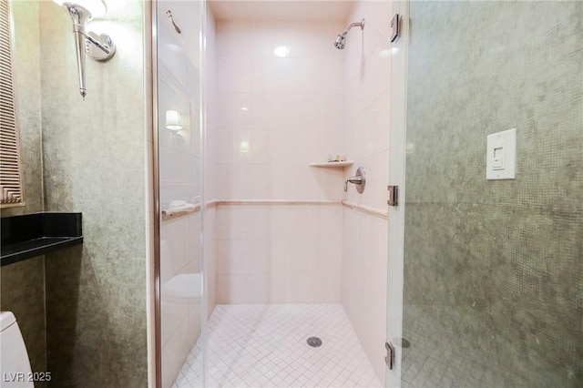 full bathroom featuring a shower stall