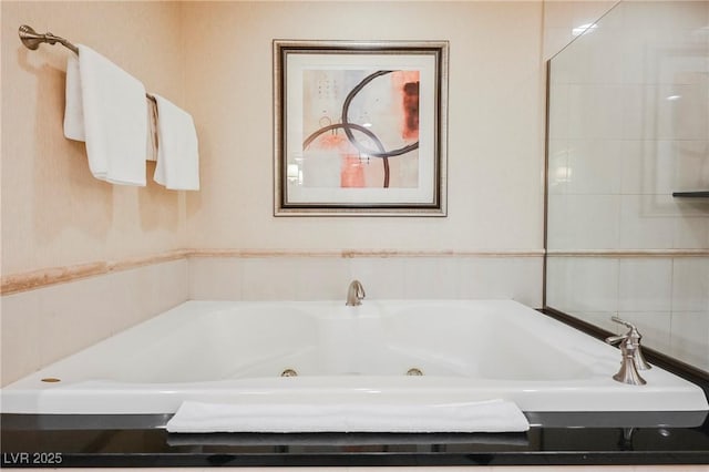 full bathroom featuring a whirlpool tub
