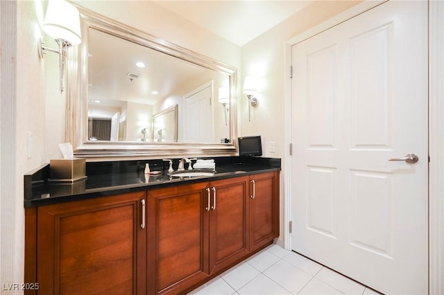 bathroom featuring vanity, visible vents, and tile patterned flooring