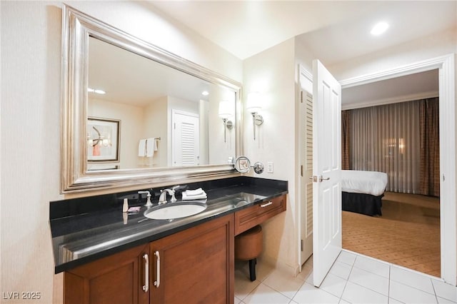 bathroom with tile patterned flooring, recessed lighting, and vanity