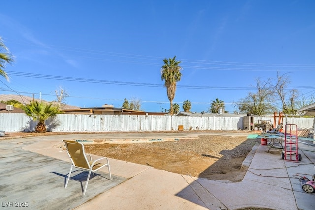 2450 Tournament St, Las Vegas, NV 89142 - view of yard featuring a fenced backyard and a patio