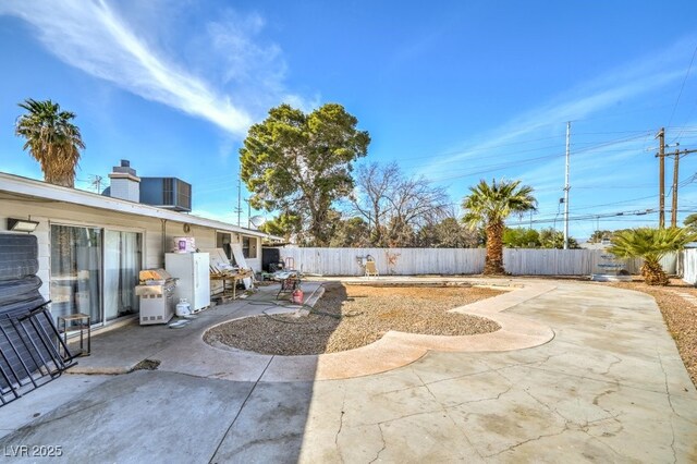 2450 Tournament St, Las Vegas, NV 89142 - view of yard with a patio and a fenced backyard