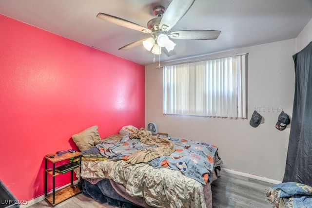 2450 Tournament St, Las Vegas, NV 89142 - bedroom featuring a ceiling fan, wood finished floors, and baseboards