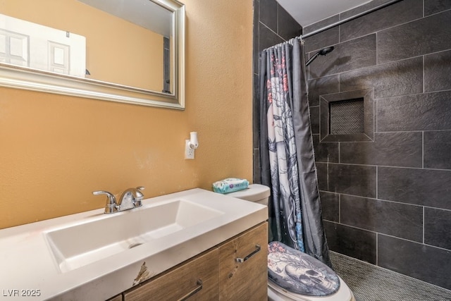 2450 Tournament St, Las Vegas, NV 89142 - bathroom featuring vanity, toilet, and tiled shower