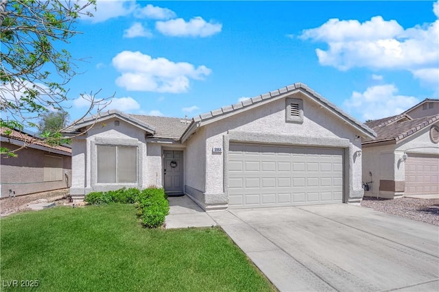 5988 Turtle River Ave, Las Vegas, NV 89156 - single story home with a garage, concrete driveway, a tile roof, a front lawn, and stucco siding