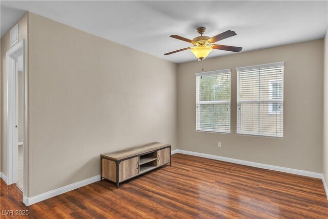 2376 Via Firenze, Henderson, NV 89044 - empty room with baseboards, dark wood-style floors, and a ceiling fan