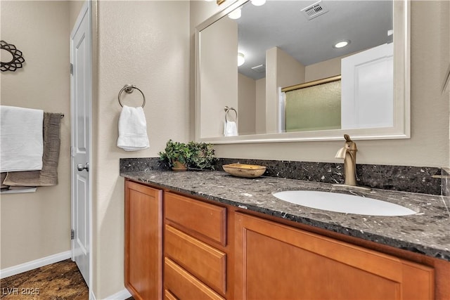 2376 Via Firenze, Henderson, NV 89044 - full bath featuring vanity, a shower with shower door, and baseboards
