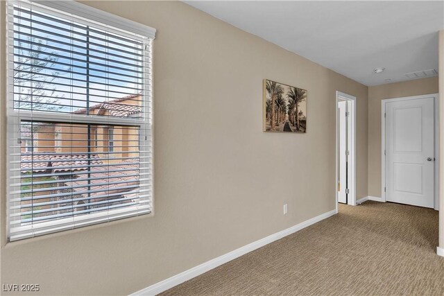 2376 Via Firenze, Henderson, NV 89044 - carpeted empty room featuring baseboards and plenty of natural light