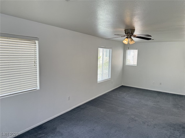 5661 Bonds Flat St, Las Vegas, NV 89148 - empty room with dark colored carpet, ceiling fan, baseboards, and a textured ceiling