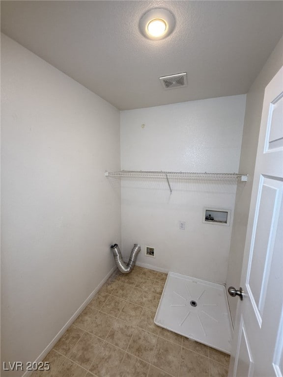 5661 Bonds Flat St, Las Vegas, NV 89148 - laundry area featuring hookup for a washing machine, baseboards, and a textured ceiling