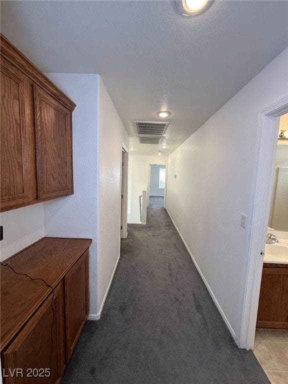 5661 Bonds Flat St, Las Vegas, NV 89148 - corridor featuring carpet flooring and baseboards