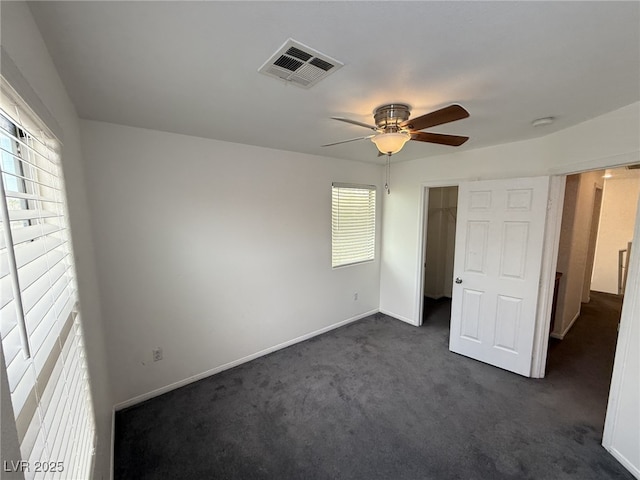 5661 Bonds Flat St, Las Vegas, NV 89148 - unfurnished bedroom with dark colored carpet, baseboards, and ceiling fan
