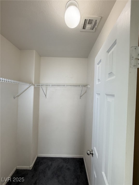 5661 Bonds Flat St, Las Vegas, NV 89148 - spacious closet featuring dark carpet