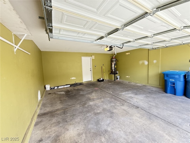 5661 Bonds Flat St, Las Vegas, NV 89148 - garage featuring strapped water heater and a garage door opener