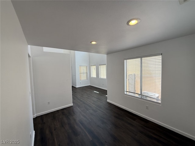 5661 Bonds Flat St, Las Vegas, NV 89148 - spare room featuring baseboards, dark wood-style flooring, and recessed lighting