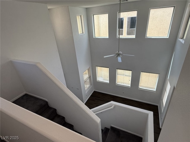 5661 Bonds Flat St, Las Vegas, NV 89148 - entryway featuring ceiling fan, dark wood-style flooring, baseboards, and a towering ceiling