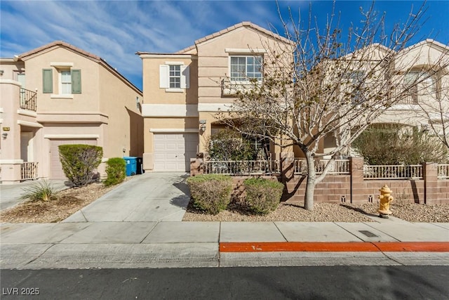 view of front of property featuring a tiled roof, stucco siding, driveway, and an attached garage