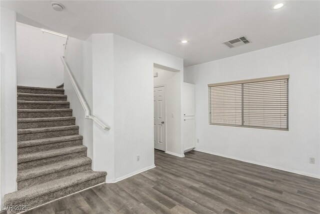 interior space featuring visible vents, wood finished floors, recessed lighting, stairway, and baseboards