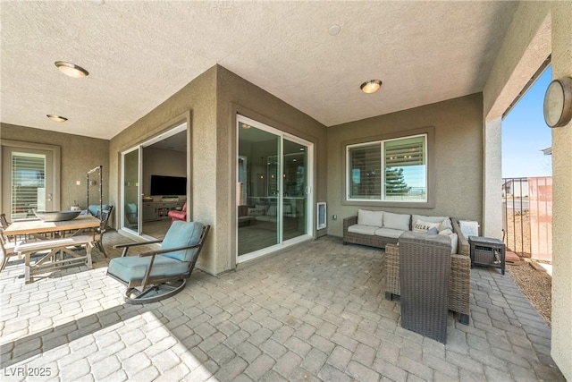 view of patio / terrace featuring an outdoor living space and outdoor dining space