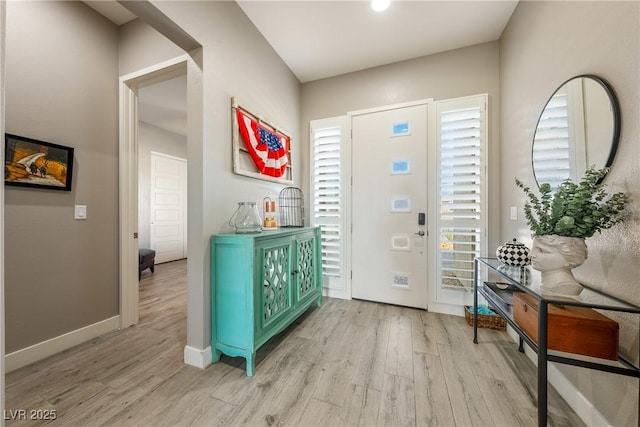 entrance foyer featuring baseboards and light wood-style floors