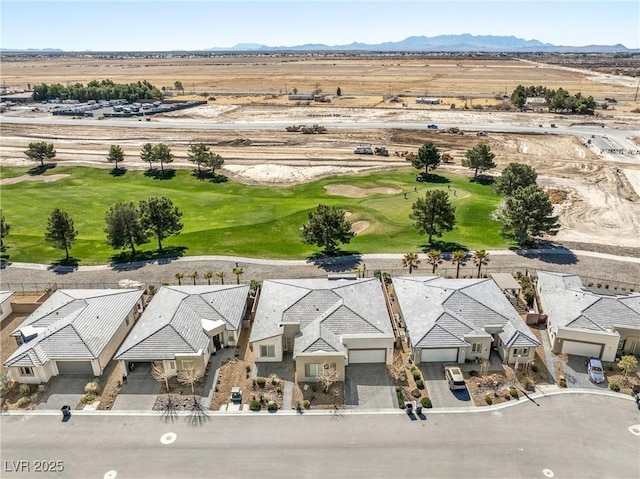 bird's eye view featuring a mountain view, golf course view, and a residential view
