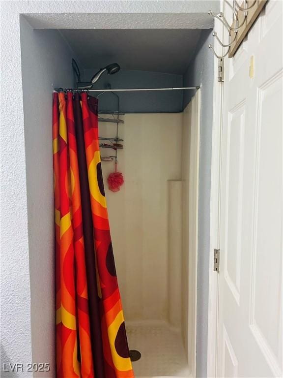 228 E Van Wagenen St, Henderson, NV 89015 - bathroom featuring a stall shower and a textured ceiling