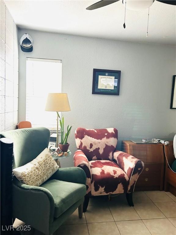228 E Van Wagenen St, Henderson, NV 89015 - living room with a ceiling fan and light tile patterned floors
