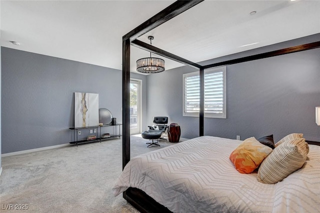 bedroom featuring carpet and baseboards