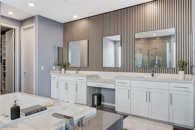 full bathroom featuring vanity, recessed lighting, and a shower stall