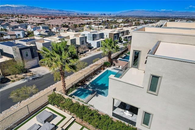 birds eye view of property with a mountain view and a residential view