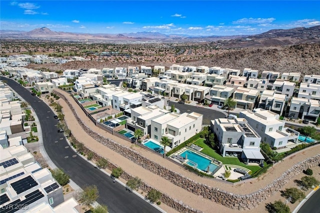 birds eye view of property featuring a mountain view and a residential view