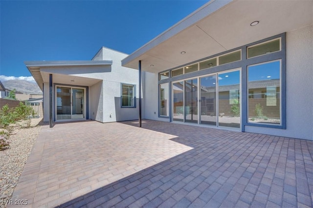990 Golden Sands Dr, Las Vegas, NV 89128 - rear view of property featuring a patio, stucco siding, and fence
