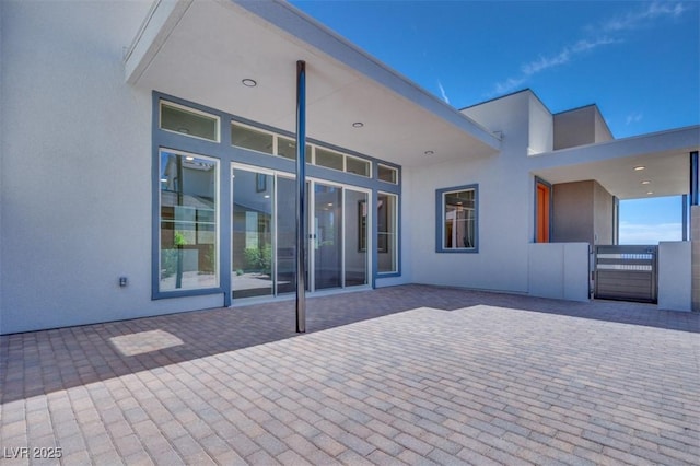 990 Golden Sands Dr, Las Vegas, NV 89128 - back of house featuring stucco siding and a patio area