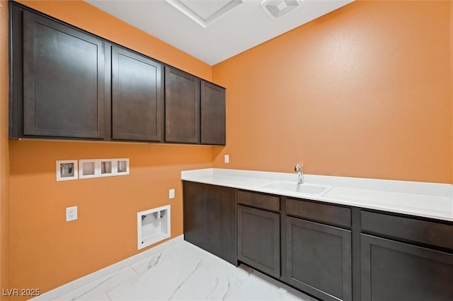 laundry area featuring cabinet space, a sink, hookup for a washing machine, marble finish floor, and visible vents